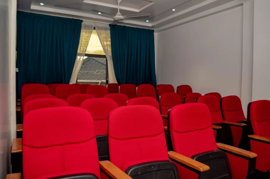 Conference hall at Skycity Hotel with red theatre-style seating