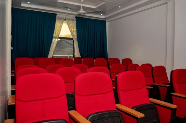 Conference hall at Skycity Hotel with red theatre-style seating
