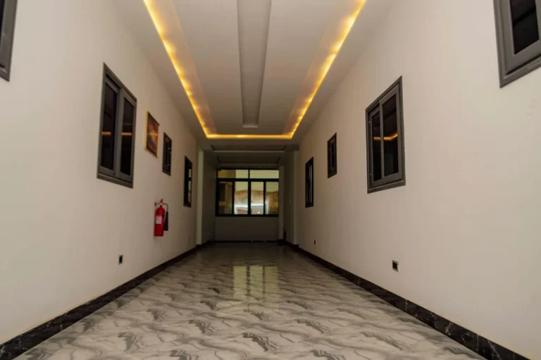 Hotel corridor with warm cove lighting at Skycity Hotel