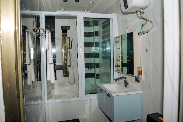 En-suite bathroom with shower and vanity at Skycity Hotel