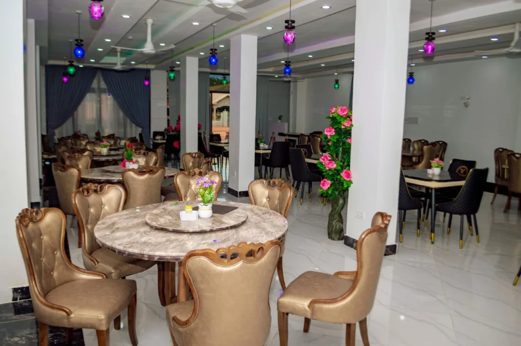 Round dining tables and gold chairs in the Skycity Hotel restaurant