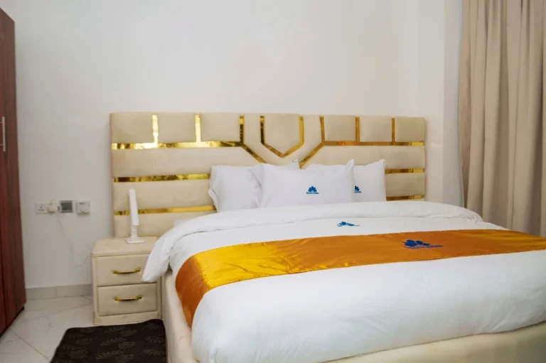 Cream bed with gold accents at Skycity Hotel