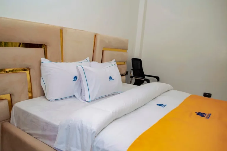 Premium room with gold-trim headboard and desk at Skycity Hotel