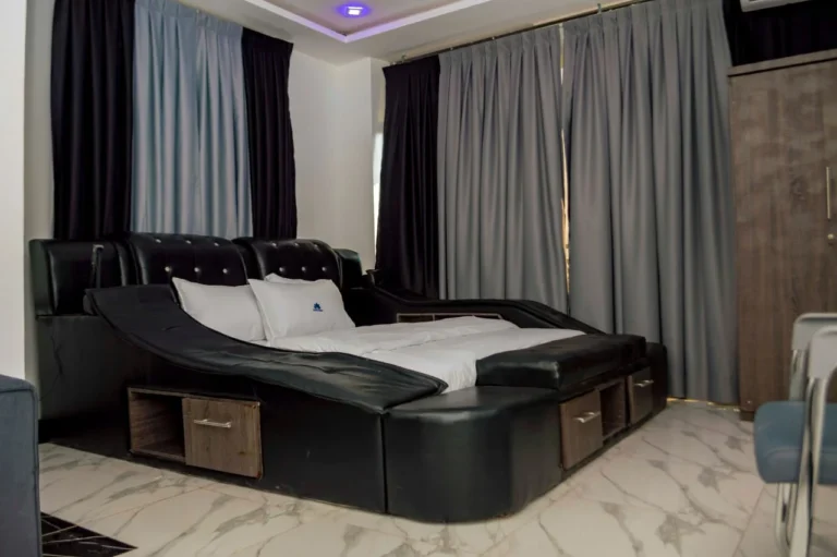 Room with black leather king bed at Skycity Hotel