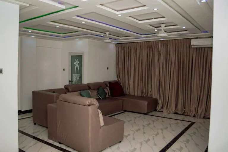 Suite living room with L-shaped sofa at Skycity Hotel