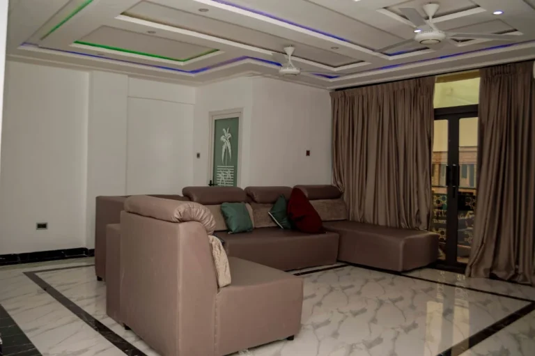Suite lounge with sofa and balcony doors at Skycity Hotel