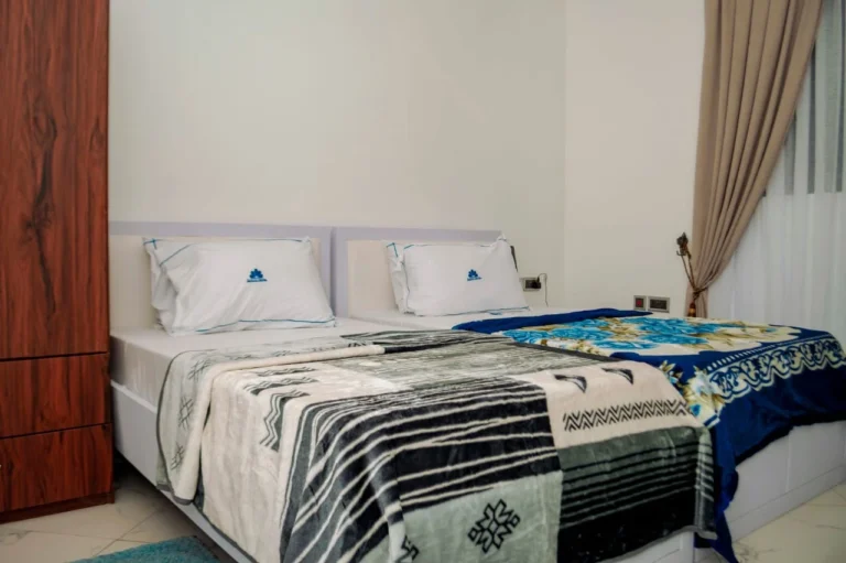 Twin room with patterned bedding at Skycity Hotel
