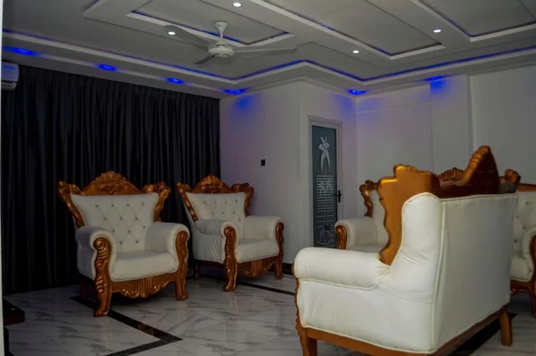 VIP lounge at Skycity Hotel with white and gold armchairs